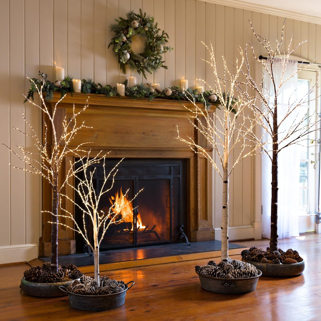 How to Decorate With Birch Lighted Trees on a Fireplace